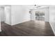 Spacious bedroom featuring dark grey vinyl flooring and sliding glass doors at 1522 Pleasant Rd # G23, Bradenton, FL 34207