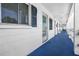 Clean condo hallway with blue floor and white walls at 1522 Pleasant Rd # G23, Bradenton, FL 34207