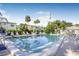Community pool with surrounding lounge chairs at 1522 Pleasant Rd # G23, Bradenton, FL 34207