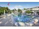 Community pool and patio area with seating at 1522 Pleasant Rd # G23, Bradenton, FL 34207
