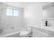 Simple white bathroom with a tub, toilet, and vanity at 1522 Pleasant Rd # G23, Bradenton, FL 34207