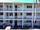 Exterior view of a condo building showing a single unit entrance at 1522 Pleasant Rd # G23, Bradenton, FL 34207