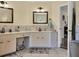 Double vanity bathroom with a large mirror and tile flooring at 5747 29Th E St, Bradenton, FL 34203