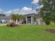 Beautiful Florida home with palm trees and well-manicured lawn at 5747 29Th E St, Bradenton, FL 34203