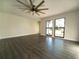 Spacious living room featuring hardwood floors and ceiling fan at 607 Bradenton Rd, Venice, FL 34293