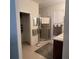 Well-lit bathroom with glass shower, neutral-toned towels, and a clean, functional design at 7818 33Rd E St, Sarasota, FL 34243