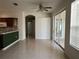 Open dining area features sliding glass doors leading outside, and a breakfast bar connecting to the kitchen at 7818 33Rd E St, Sarasota, FL 34243