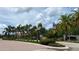 Community entrance with brick road, landscaping, and signage at 7818 33Rd E St, Sarasota, FL 34243