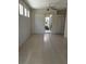 Bright living room with tile flooring, slider to patio and natural light at 7818 33Rd E St, Sarasota, FL 34243