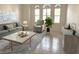 Comfortable living room filled with natural light, neutral furniture and a soft blue area rug at 7818 33Rd E St, Sarasota, FL 34243