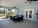 Covered patio with ceiling fans and seating offers a relaxing outdoor space at 7818 33Rd E St, Sarasota, FL 34243