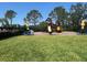 Community playground with picnic tables, slide, and play structure at 7818 33Rd E St, Sarasota, FL 34243