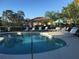Community pool featuring shallow end and lounge chairs at 7818 33Rd E St, Sarasota, FL 34243