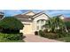 Charming villa with lush landscaping, paved driveway and an attached garage at 7818 33Rd E St, Sarasota, FL 34243