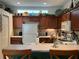 Well-equipped kitchen with wood cabinets and a breakfast bar at 7818 33Rd E St, Sarasota, FL 34243