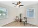 Bedroom with ceiling fan and two chairs at 1610 Marilyn Ave, Bradenton, FL 34207