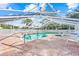 Community pool with covered patio and plenty of seating at 6052 Bonaventure Pl, Sarasota, FL 34243