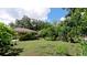 Large backyard with lush landscaping and garden at 823 32Nd E Ave, Bradenton, FL 34208