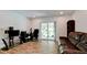 Home office with built-in shelving and sliding glass doors leading to backyard at 823 32Nd E Ave, Bradenton, FL 34208