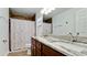 Updated bathroom with double vanity, shower, and granite countertop at 823 32Nd E Ave, Bradenton, FL 34208