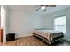 Bedroom with ceiling fan and view of adjacent bathroom at 823 32Nd E Ave, Bradenton, FL 34208