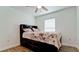 Bright bedroom with ceiling fan and wood-look tile flooring at 823 32Nd E Ave, Bradenton, FL 34208