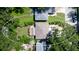 Aerial view of a house and surrounding lot with lush green trees at 823 32Nd E Ave, Bradenton, FL 34208
