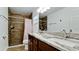 Updated bathroom with double vanity, shower, and granite countertop at 823 32Nd E Ave, Bradenton, FL 34208
