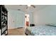 Bedroom with built-in shelving and adjacent bathroom at 823 32Nd E Ave, Bradenton, FL 34208