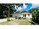 Cute one-story house with a grassy yard at 823 32Nd E Ave, Bradenton, FL 34208