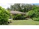 Large backyard with lush landscaping and garden at 823 32Nd E Ave, Bradenton, FL 34208