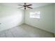 Bright bedroom with tile floors, ceiling fan, and ample closet space at 4573 Mcintosh Ln, Sarasota, FL 34232