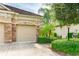 Two-car garage with stone accents and a generator at 4015 Celestial Blue Ct, Bradenton, FL 34211