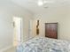 Spacious bedroom with a queen-size bed and easy access to closets at 4015 Celestial Blue Ct, Bradenton, FL 34211