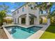 View of a rectangular pool with a tanning ledge and seating area at 2425 Temple St, Sarasota, FL 34239