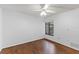 Simple bedroom with hardwood floors and a window offering natural light at 4573 Kingsmere # 27, Sarasota, FL 34235