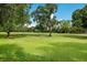 Expansive green space showcasing the beauty of the golf course at 4573 Kingsmere # 27, Sarasota, FL 34235