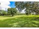 Landscaped golf course with lush greenery and mature trees at 4573 Kingsmere # 27, Sarasota, FL 34235