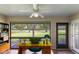 Home office with a golf course view, built-in shelving, and plenty of natural light at 4573 Kingsmere # 27, Sarasota, FL 34235