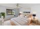 Relaxing main bedroom with ample natural light and a view of the golf course at 4573 Kingsmere # 27, Sarasota, FL 34235