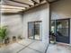 Private patio with sliding glass door access to interior and wood pergola at 4573 Kingsmere # 27, Sarasota, FL 34235