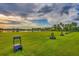 Driving range with lush green grass and palm trees at 5092 Mahogany Run Ave, Sarasota, FL 34241