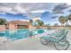 Community pool with surrounding patio and lounge chairs at 5092 Mahogany Run Ave, Sarasota, FL 34241