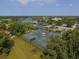 Two tennis courts with surrounding landscape at 5092 Mahogany Run Ave, Sarasota, FL 34241