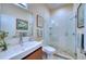 Bright bathroom featuring a glass-enclosed shower, modern vanity, and neutral tones, creating a spa-like atmosphere at 7204 Saint Georges Way, University Park, FL 34201