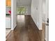 Hardwood floors in entryway, view to living room and kitchen at 4573 Kingsmere # 27, Sarasota, FL 34235