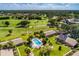 Aerial view of community pool and surrounding homes at 4573 Kingsmere # 27, Sarasota, FL 34235
