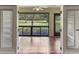 View from inside, looking out to a screened porch and golf course at 4573 Kingsmere # 27, Sarasota, FL 34235