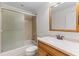 Bathroom with light wood vanity, large mirror, and shower/tub at 4573 Kingsmere # 27, Sarasota, FL 34235