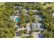 Aerial view of community tennis courts and pool at 4573 Kingsmere # 27, Sarasota, FL 34235